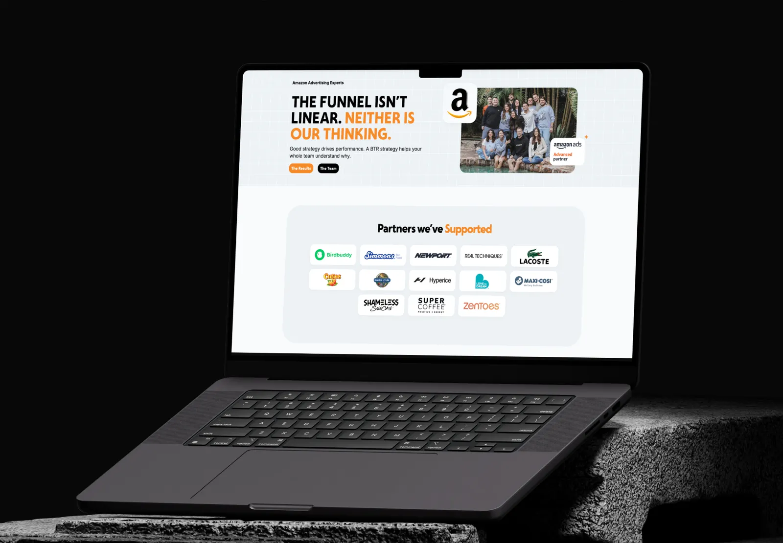 BTR Media page with partner brand logos on a laptop